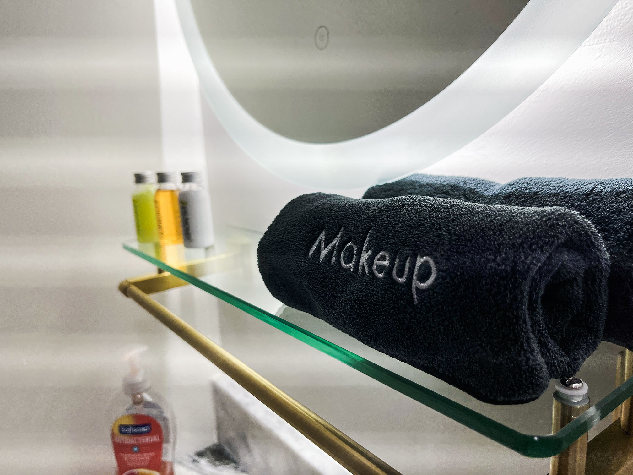 Towel nicely folded in front of a mirror